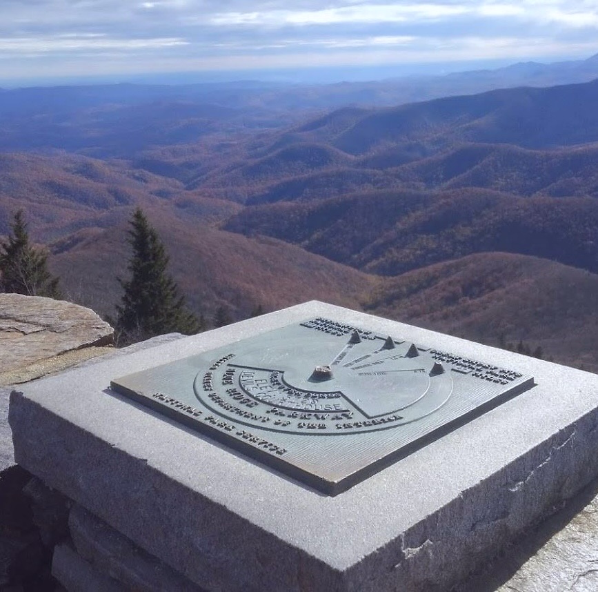 Mountain compass marker at a summit overlook in the Blue Ridge Mountains of Western North Carolina